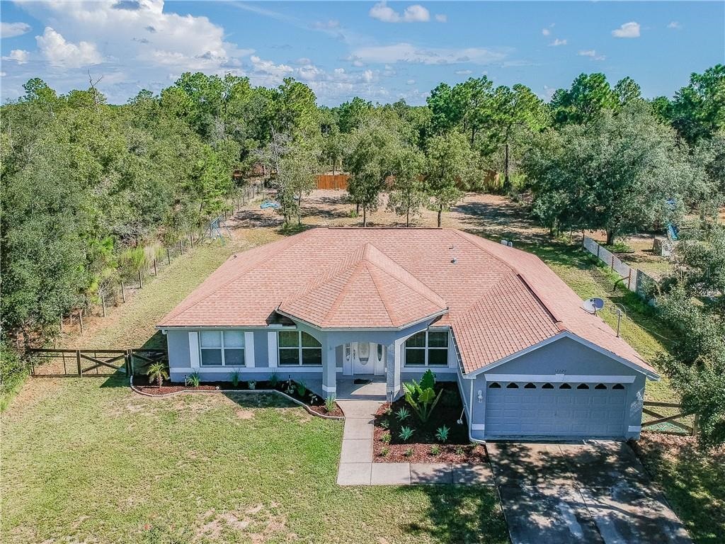 Aerial view of a home on a large wooded lot in Royal Highlands, Weeki Wachee FL